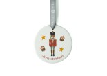 White ceramic christmas tree decoration with the image of a cute nutcracker soldier